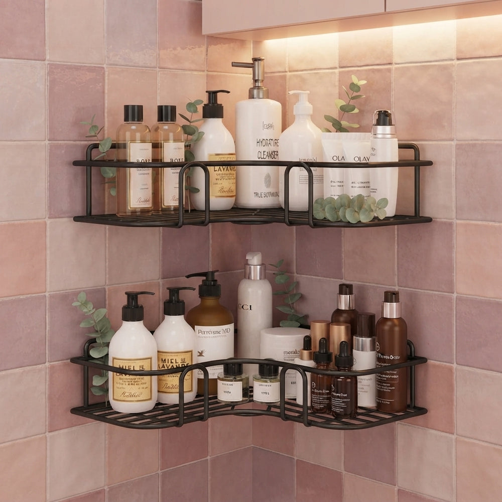 Two metal corner shower racks mounted on a modern bathroom wall, neatly holding luxury skincare bottles and greenery.